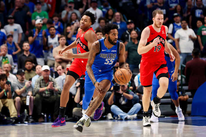 Mavs' Derrick Jones Jr. dribbles up the floor against the Toronto Raptors.